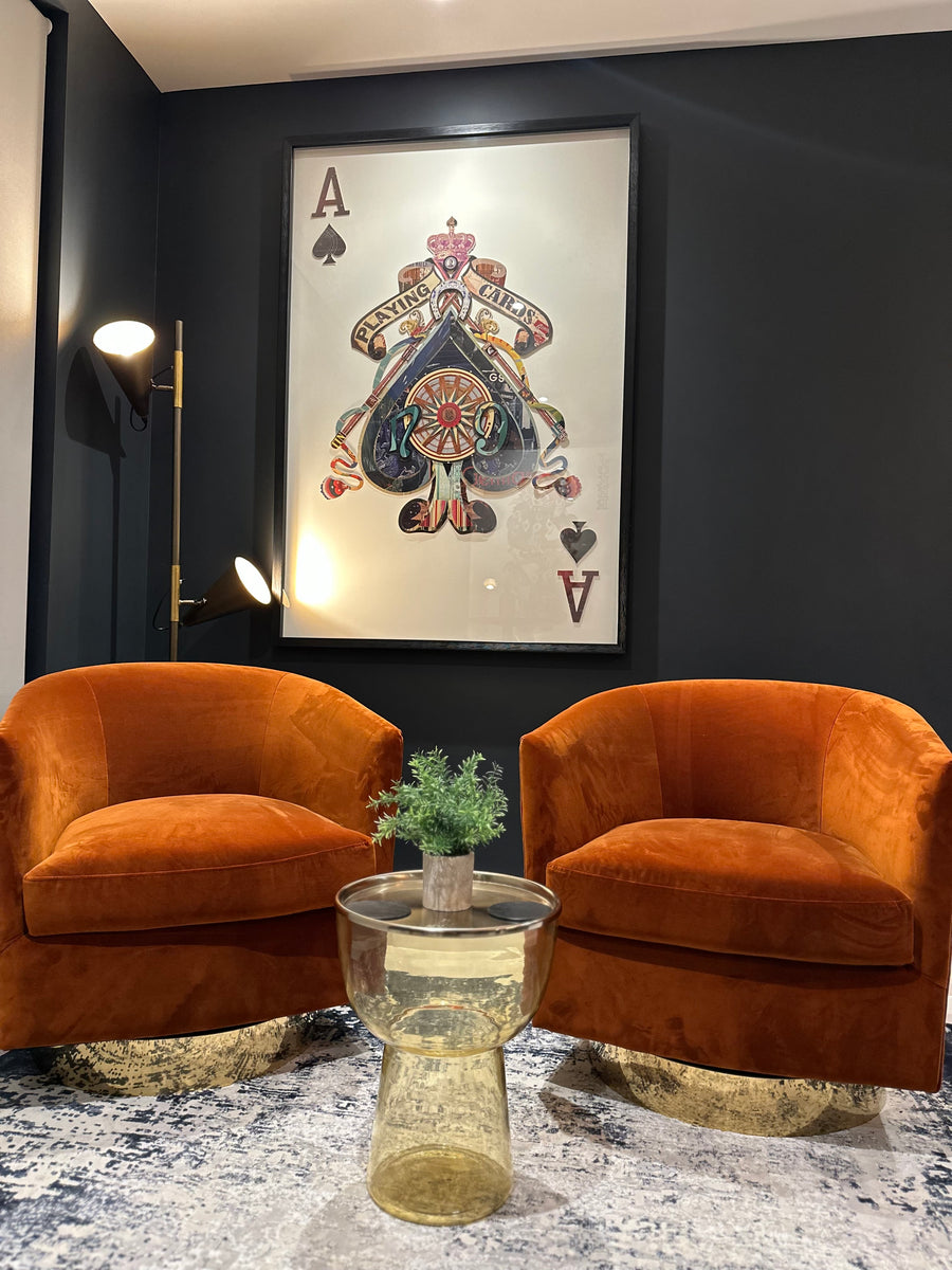 Burnt orange occasional swivel chair with brass trim – Ellie's